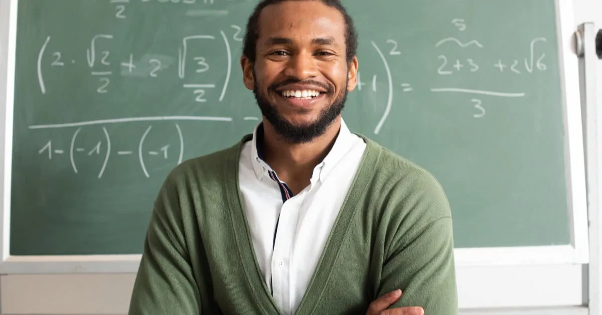 Male Teacher & Chalkboard